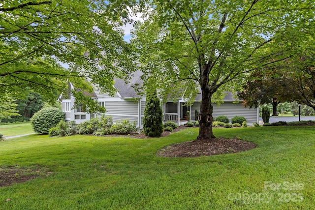 104 Overlook Dr, Flat Rock, NC 28731 - view of front facade with a shingled roof and a front yard