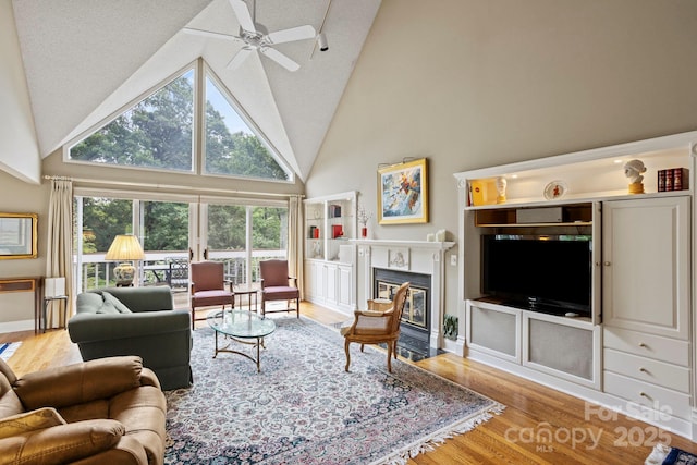 104 Overlook Dr, Flat Rock, NC 28731 - living area with wood finished floors, high vaulted ceiling, ceiling fan, and a fireplace with flush hearth