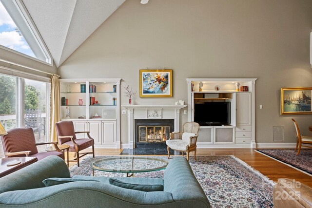 104 Overlook Dr, Flat Rock, NC 28731 - living room with high vaulted ceiling, wood finished floors, and a fireplace with flush hearth
