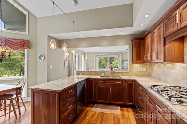 104 Overlook Dr, Flat Rock, NC 28731 - kitchen featuring dishwashing machine, stainless steel gas stovetop, light wood-style flooring, decorative backsplash, and recessed lighting