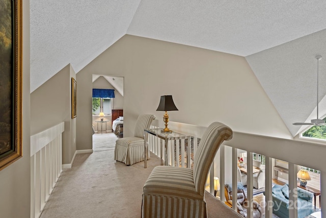 104 Overlook Dr, Flat Rock, NC 28731 - sitting room with vaulted ceiling, plenty of natural light, a textured ceiling, light colored carpet, and a ceiling fan