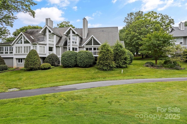 104 Overlook Dr, Flat Rock, NC 28731 - back of property with a chimney and a yard