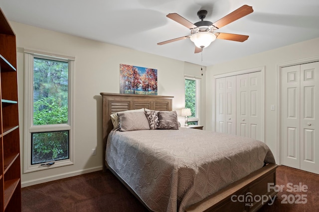 168 Overlook Dr, Flat Rock, NC 28731 - bedroom with dark carpet, multiple closets, and ceiling fan