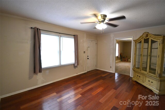 416 E Union St, Marshville, NC 28103 - spare room featuring wood finished floors, ceiling fan, crown molding, and a textured ceiling