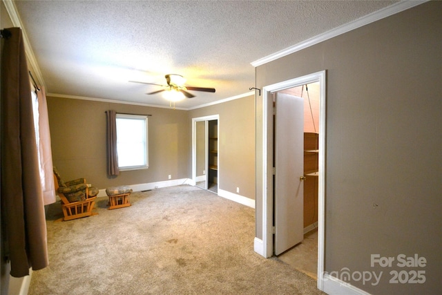 416 E Union St, Marshville, NC 28103 - unfurnished bedroom with a textured ceiling, crown molding, carpet, and ceiling fan