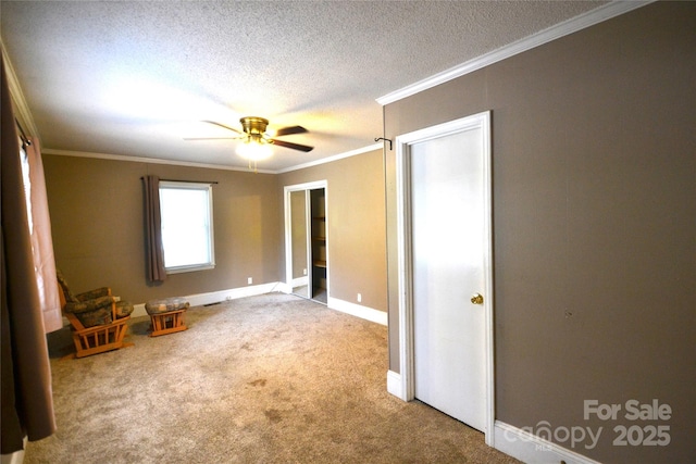 416 E Union St, Marshville, NC 28103 - unfurnished bedroom with carpet, a textured ceiling, crown molding, and a ceiling fan