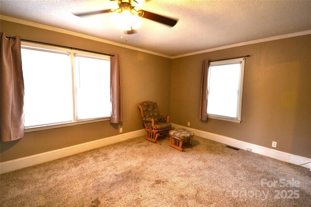416 E Union St, Marshville, NC 28103 - unfurnished room featuring a textured ceiling, carpet, a ceiling fan, and ornamental molding