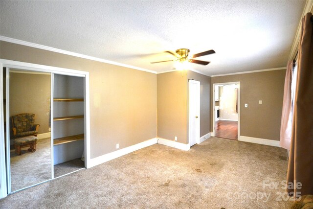 416 E Union St, Marshville, NC 28103 - unfurnished bedroom with carpet, crown molding, a textured ceiling, and ceiling fan
