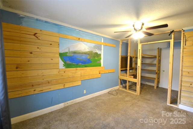 416 E Union St, Marshville, NC 28103 - unfurnished bedroom featuring carpet floors, a textured ceiling, and a ceiling fan