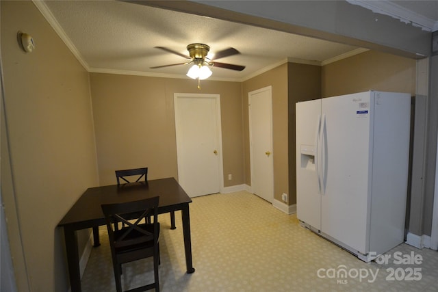 416 E Union St, Marshville, NC 28103 - kitchen with white fridge with ice dispenser, ceiling fan, and ornamental molding