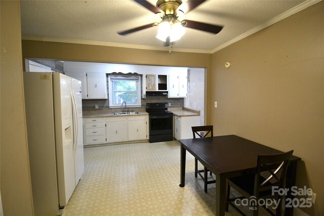 416 E Union St, Marshville, NC 28103 - kitchen featuring white fridge with ice dispenser, black electric range oven, white cabinets, range hood, and a ceiling fan