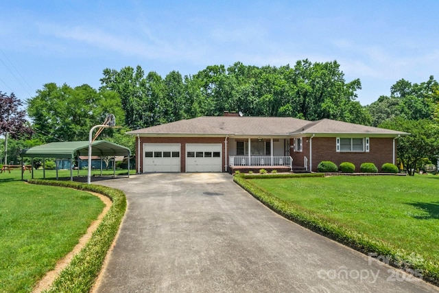 128 Howie St, Mount Holly, NC 28120 - ranch-style house with covered porch, a front yard, an attached garage, and concrete driveway