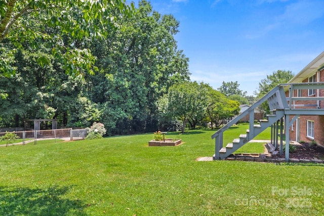 128 Howie St, Mount Holly, NC 28120 - view of grassy yard featuring stairs