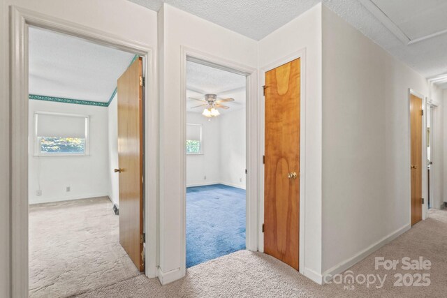 128 Howie St, Mount Holly, NC 28120 - corridor with carpet floors and a textured ceiling