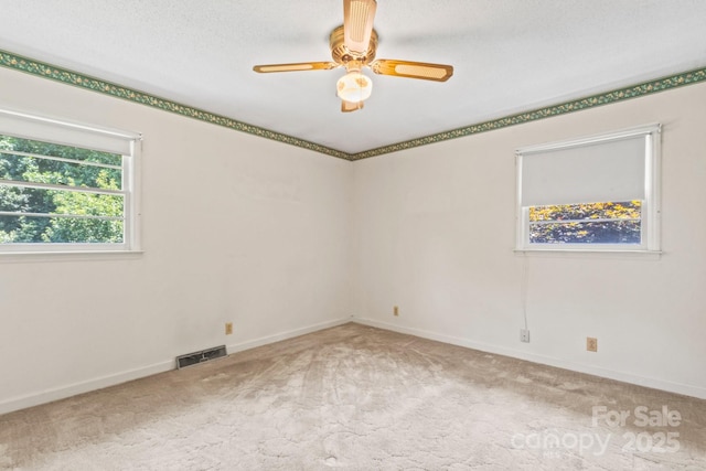 128 Howie St, Mount Holly, NC 28120 - carpeted spare room with a ceiling fan and baseboards