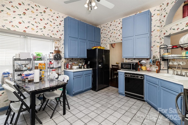 9520 Marshbrooke Rd, Matthews, NC 28105 - kitchen featuring wallpapered walls, black appliances, blue cabinets, light countertops, and a ceiling fan