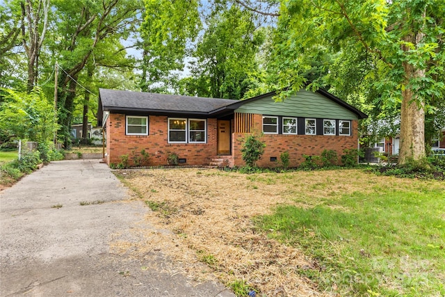 5320 Kildare Dr, Charlotte, NC 28215 - ranch-style home with asphalt driveway, brick siding, and crawl space