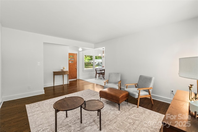 5320 Kildare Dr, Charlotte, NC 28215 - living area featuring wood finished floors and a chandelier