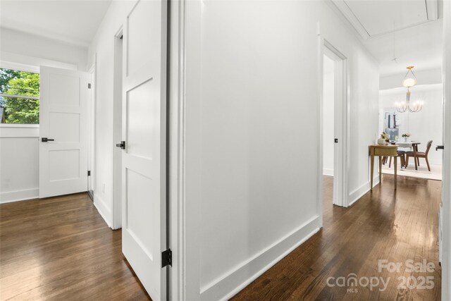 5320 Kildare Dr, Charlotte, NC 28215 - hall with attic access and dark wood-type flooring