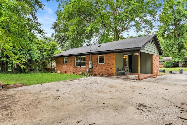 5320 Kildare Dr, Charlotte, NC 28215 - rear view of property with brick siding and a lawn