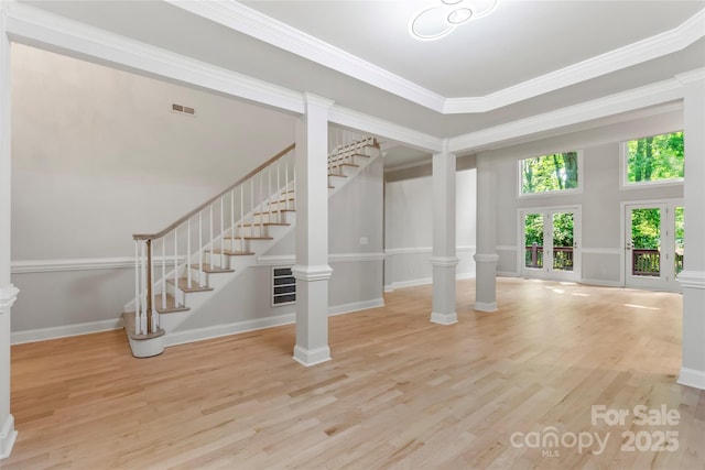3011 Mckee Rd, Charlotte, NC 28270 - foyer entrance featuring wood finished floors, stairway, crown molding, and ornate columns