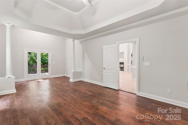 3011 Mckee Rd, Charlotte, NC 28270 - unfurnished room with decorative columns, dark wood-style flooring, a tray ceiling, a fireplace, and ornamental molding