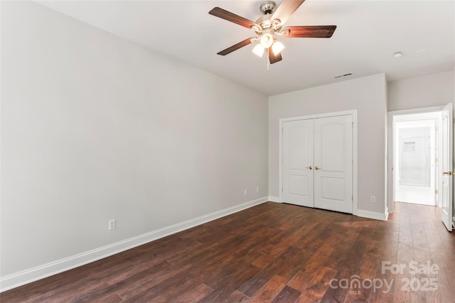 3011 Mckee Rd, Charlotte, NC 28270 - unfurnished bedroom with dark wood-type flooring, a closet, and a ceiling fan