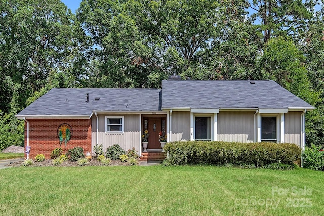 5922 Sullins Rd, Charlotte, NC 28214 - view of front of home featuring a front lawn and a chimney