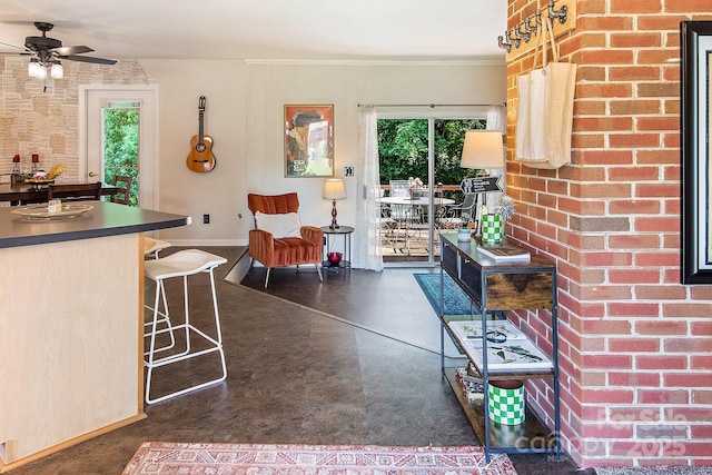 5922 Sullins Rd, Charlotte, NC 28214 - dining room with a ceiling fan, brick wall, and ornamental molding