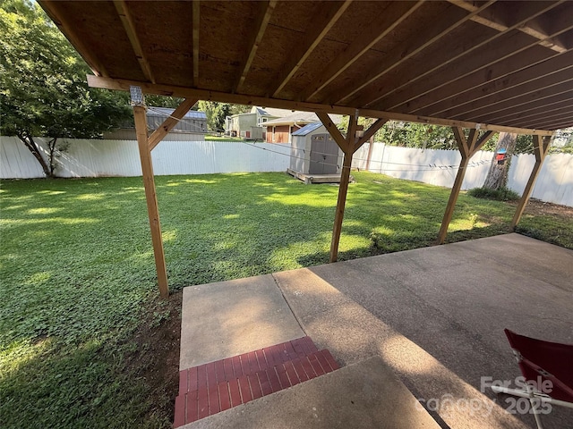 708 E St Unit 8, 9, Albemarle, NC 28001 - fenced backyard featuring a patio area and a storage unit