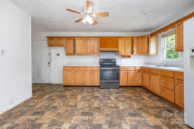 1043 Sid Davis Rd, Chester, SC 29706 - kitchen with black / electric stove, ceiling fan, stone finish floors, a textured ceiling, and light countertops