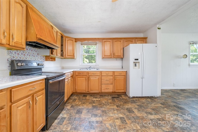 1043 Sid Davis Rd, Chester, SC 29706 - kitchen featuring black electric range, white fridge with ice dispenser, stone finish flooring, light countertops, and custom exhaust hood