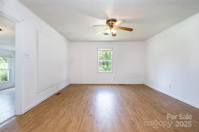 1043 Sid Davis Rd, Chester, SC 29706 - unfurnished room with wood finished floors, ceiling fan, and healthy amount of natural light