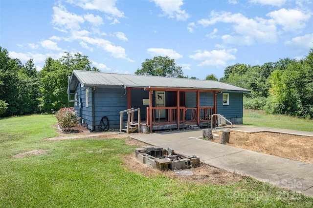 1043 Sid Davis Rd, Chester, SC 29706 - rear view of house featuring a lawn and a metal roof