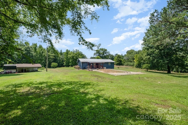 1043 Sid Davis Rd, Chester, SC 29706 - view of grassy yard featuring a patio area