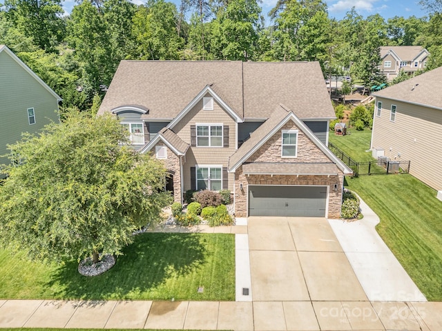 183 Canoe Pole Ln, Mooresville, NC 28117 - craftsman inspired home featuring a shingled roof, driveway, stone siding, and an attached garage