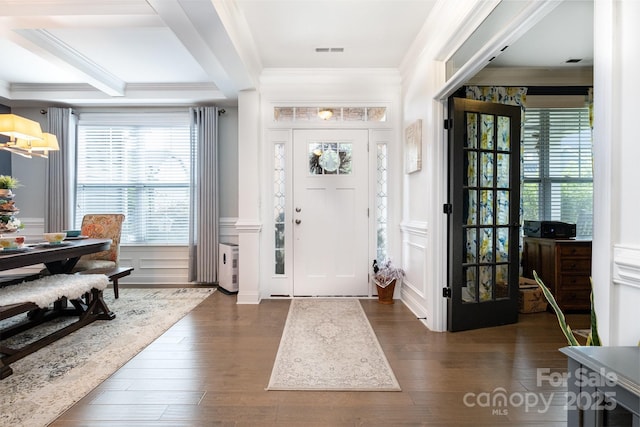 183 Canoe Pole Ln, Mooresville, NC 28117 - entrance foyer with a decorative wall, healthy amount of natural light, dark wood-style floors, crown molding, and a chandelier