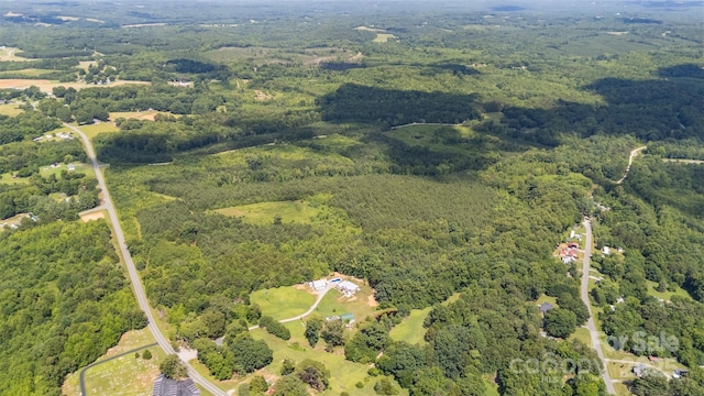 5623 Walters Mill Rd, Providence, NC 27315 - aerial view of property and surrounding area with a heavily wooded area