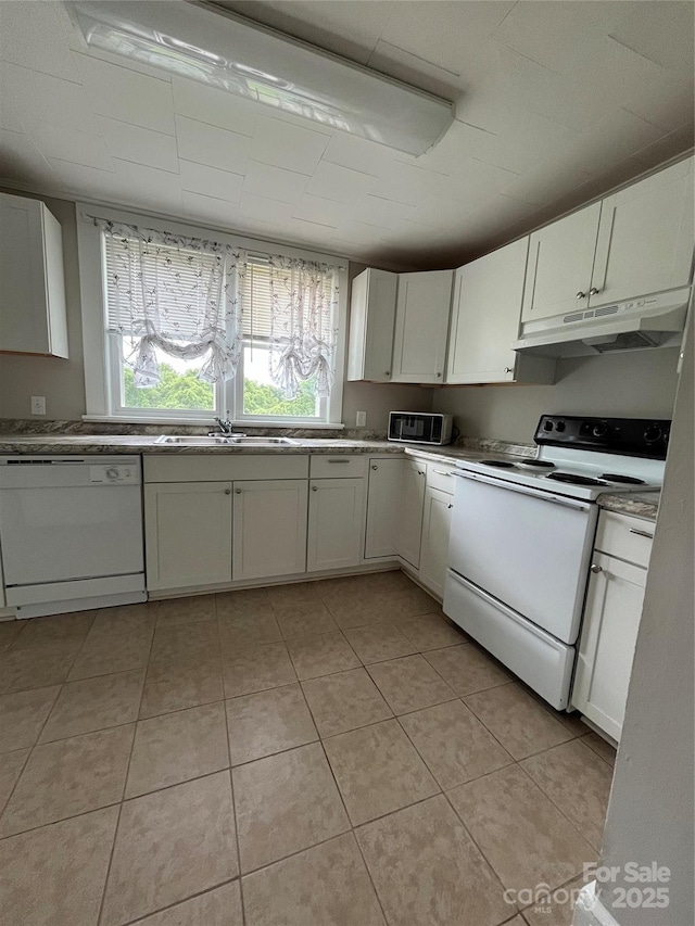 628 Main St S, Jonesville, NC 29353 - kitchen featuring white appliances, under cabinet range hood, white cabinets, and light tile patterned floors