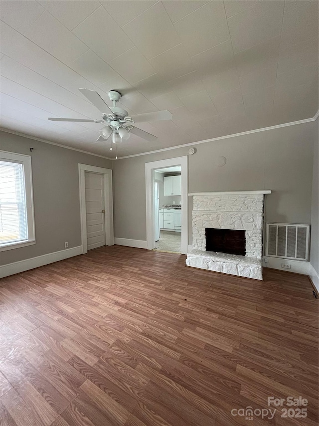 628 Main St S, Jonesville, NC 29353 - unfurnished living room with wood finished floors, ceiling fan, crown molding, and a fireplace