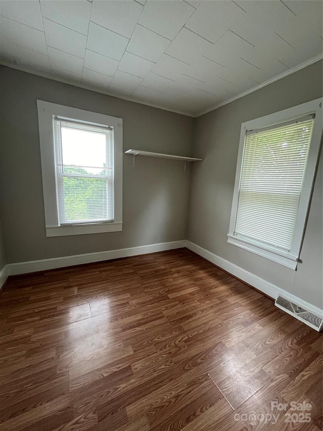 628 Main St S, Jonesville, NC 29353 - spare room featuring wood finished floors and ornamental molding