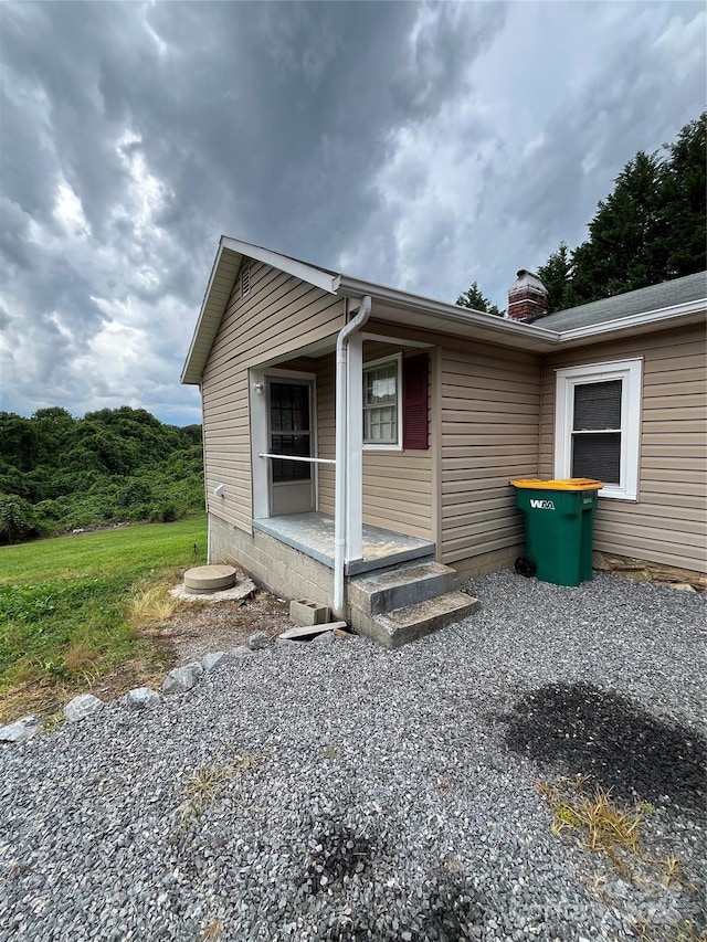 628 Main St S, Jonesville, NC 29353 - view of property exterior with a chimney