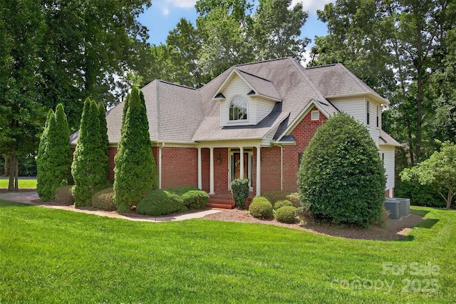 803 Woodmoore Ln, Kannapolis, NC 28081 - view of front of property featuring a front yard, brick siding, and a shingled roof