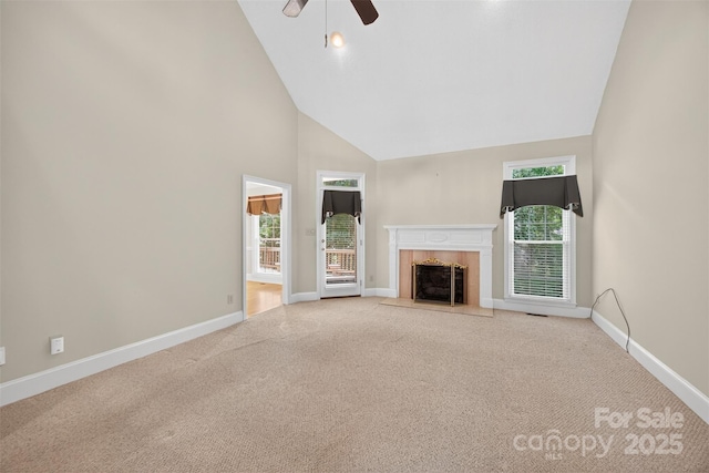803 Woodmoore Ln, Kannapolis, NC 28081 - unfurnished living room with high vaulted ceiling, a fireplace with flush hearth, carpet flooring, and ceiling fan