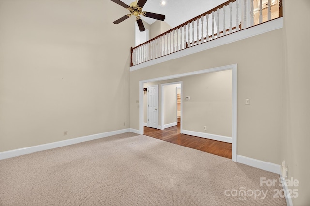 803 Woodmoore Ln, Kannapolis, NC 28081 - unfurnished living room featuring carpet, high vaulted ceiling, and a ceiling fan