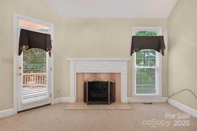 803 Woodmoore Ln, Kannapolis, NC 28081 - unfurnished living room featuring carpet flooring, a tile fireplace, and lofted ceiling