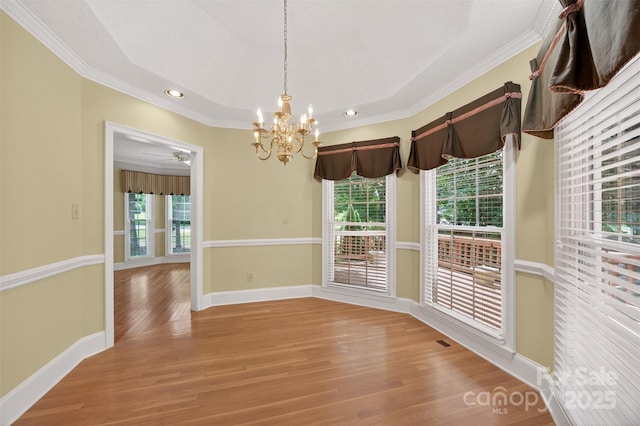 803 Woodmoore Ln, Kannapolis, NC 28081 - unfurnished dining area with a chandelier, crown molding, light wood-style floors, recessed lighting, and a ceiling fan