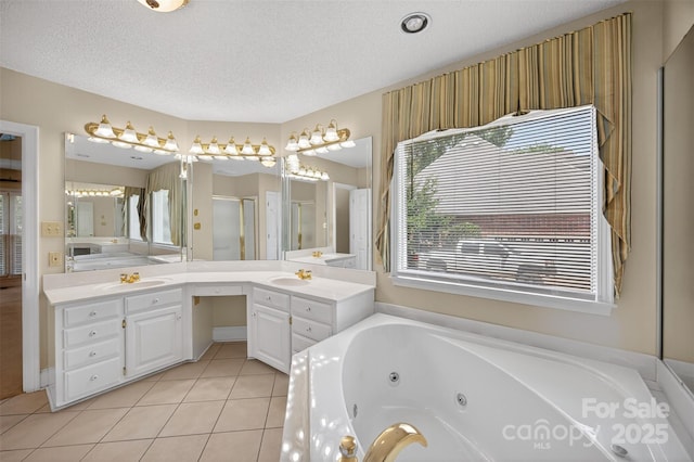803 Woodmoore Ln, Kannapolis, NC 28081 - full bath featuring a jetted tub, vanity, a shower stall, tile patterned floors, and a textured ceiling