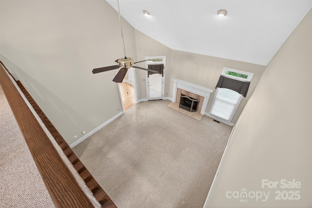 803 Woodmoore Ln, Kannapolis, NC 28081 - unfurnished living room with carpet floors, lofted ceiling, ceiling fan, a premium fireplace, and plenty of natural light