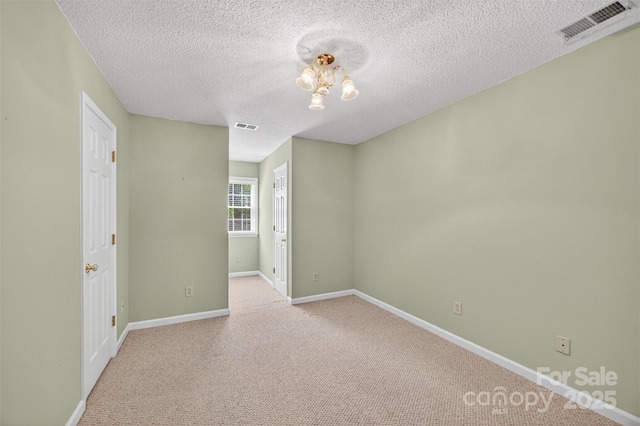 803 Woodmoore Ln, Kannapolis, NC 28081 - unfurnished room featuring light carpet and a textured ceiling